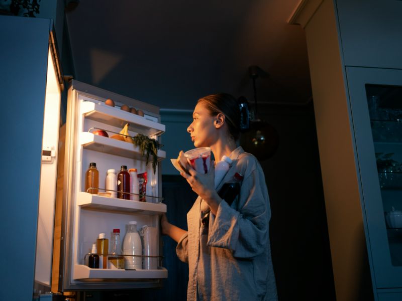 woman having snacks low angle 